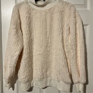 Cream sweater never wore. Was given to me as a gift.